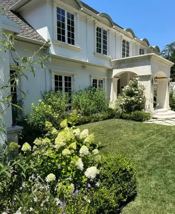well-manicured garden with a lush green lawn