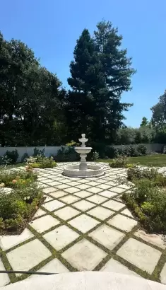 Atherton_Bay_Area_Landscaping_Portfolio_Petrus_Landscape (2) fountain surrounded with flower beds