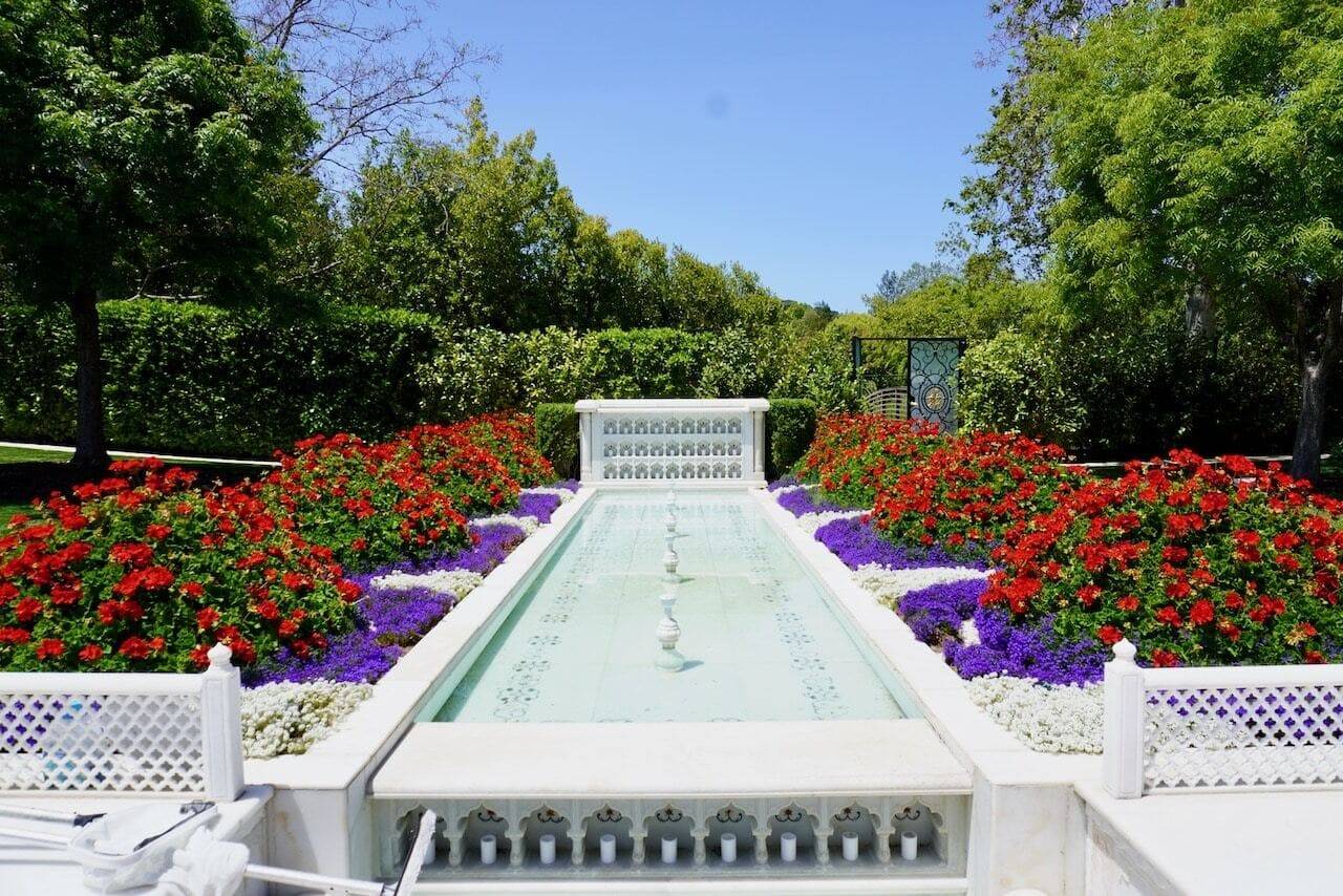 Water feature surrounded with flowers